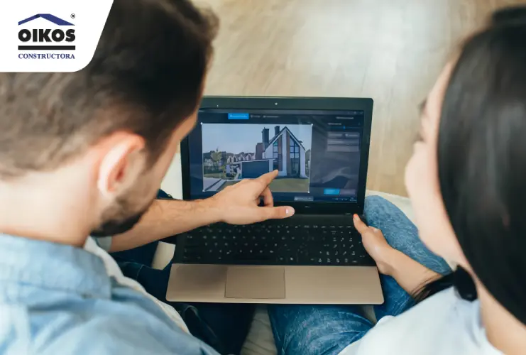 Pareja viendo vivienda en un portátil