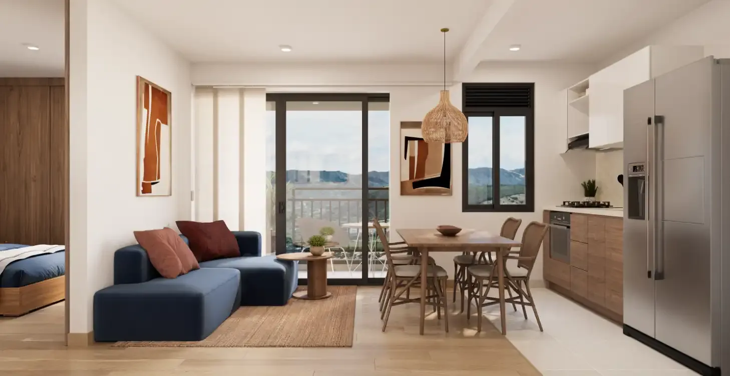 Interior de apartamento amoblado en OIKOS Playa Dorada con sala, comedor y cocina integrada