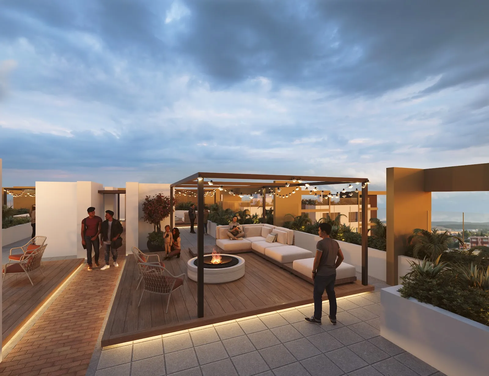 Terraza panorámica con zona de descanso y fogata en el último piso de OIKOS Sevillana.